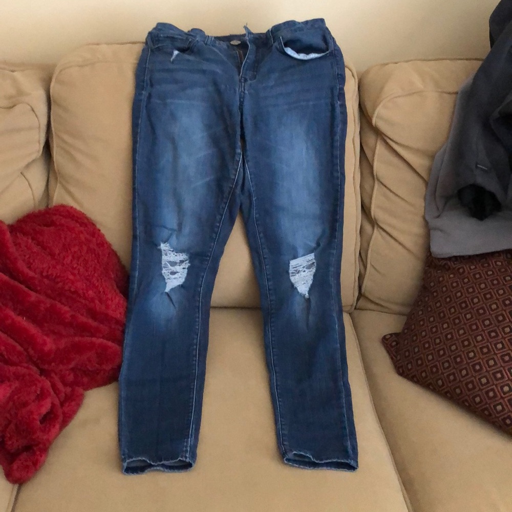 Blue jeans with ripped knees